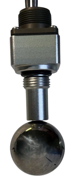 KasperAero 1030 series NZMS debris sensor holding a 1.500 inch steel ball on its collection face